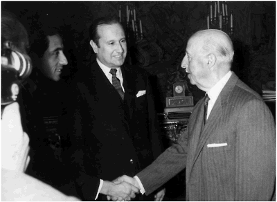 The author shaking hands with Francisco Franco At center is Misael Pastrana - photo 4