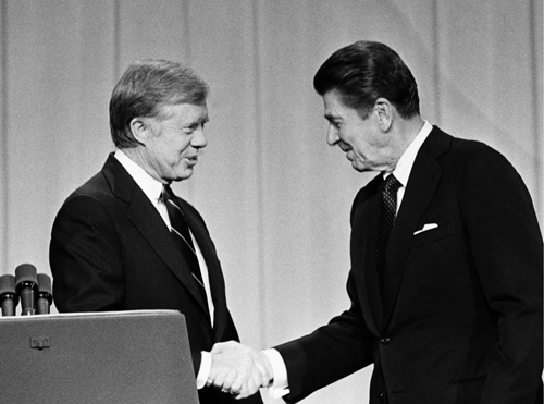 Jimmy Carter and Ronald Reagan shake hands as they greet each other before - photo 3