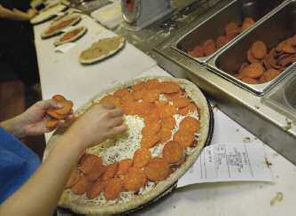 A pepperoni pizza is made to order Although Italians lay claim to the - photo 5