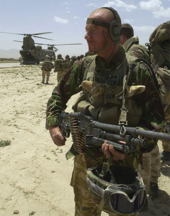 Men of 45 Commando being air lifted by a Chinook helicopter First published - photo 2