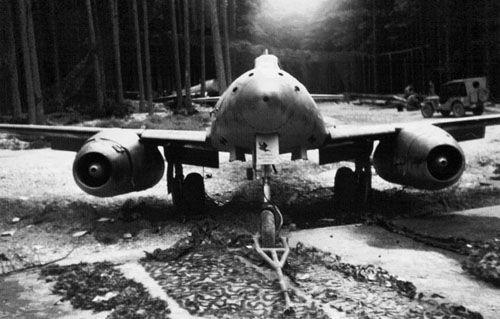 A remarkably intact Messerschmitt Me 262A abandoned in a forest clearing beside - photo 3