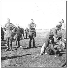 Pilots looking on as the ground crew do battle Christmas 1918 72 Sqn The - photo 4