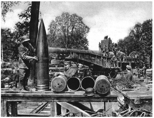 An NCO and a comparatively small gunner prepare the ammunition for the gun - photo 12