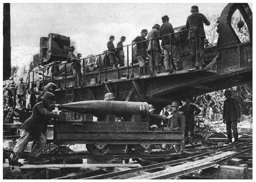 It takes four gunners to transport the shell on a small railway trolley to - photo 13