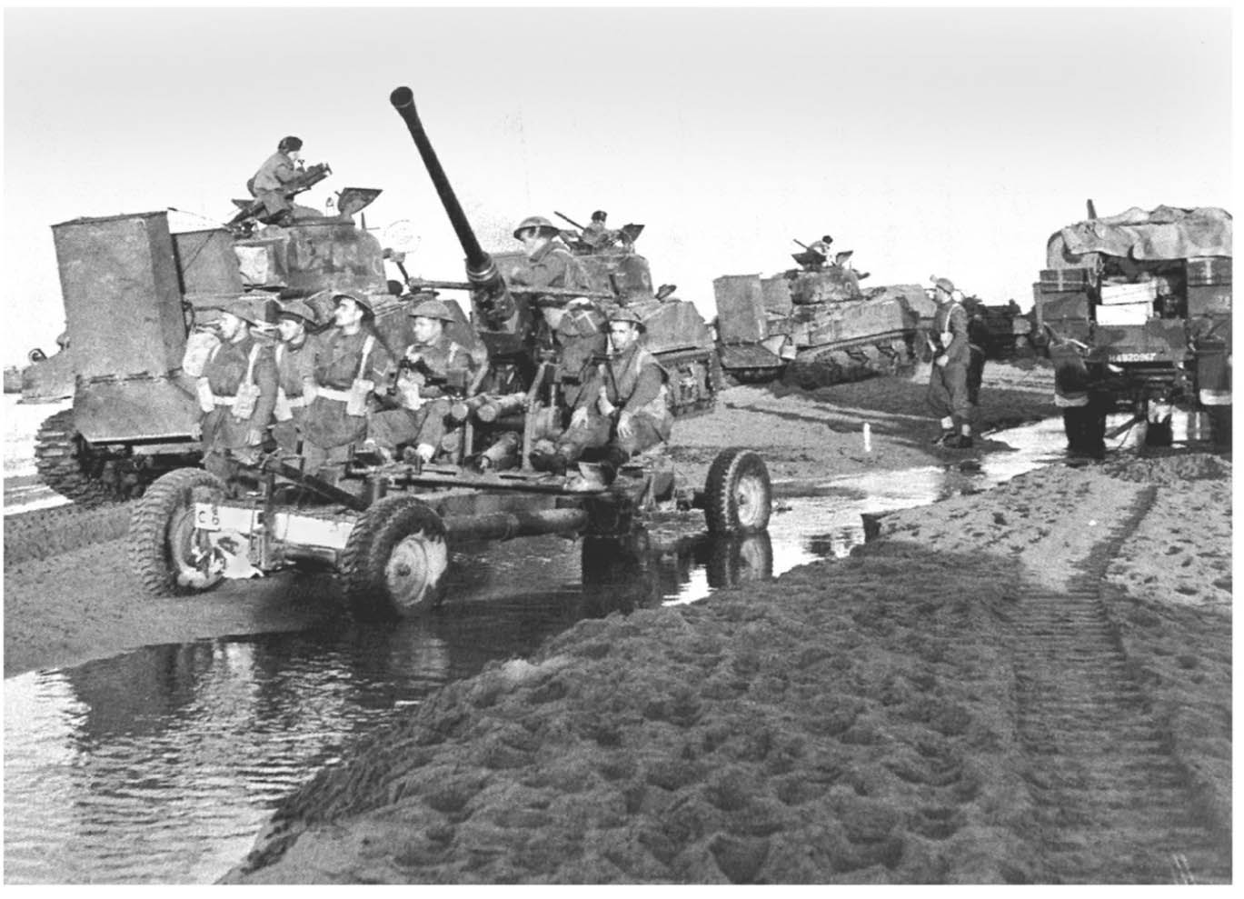 PETER Beach Shermans with wading gear come ashore under the protection of a - photo 1