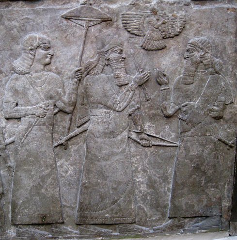 A relief depicting Ashurnasipal with official Aur All who hear the news of - photo 3