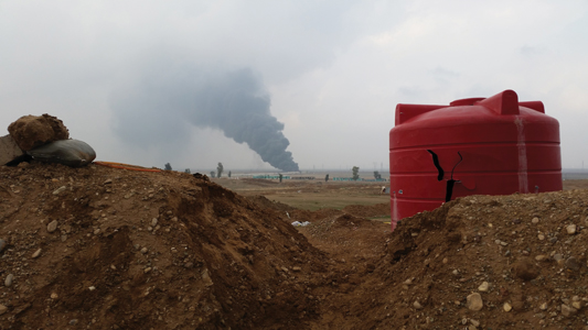 A burning oil pipeline as seen from the newly captured ridge at Tal al-Ward - photo 10