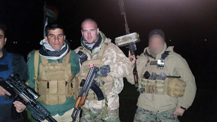 Ethan right and me with a Peshmerga fighter on the night of a big battle in - photo 24
