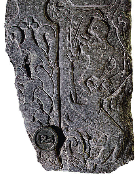 This Isle of Man runestone depicts Odin being devoured by the wolf Fenrir - photo 3