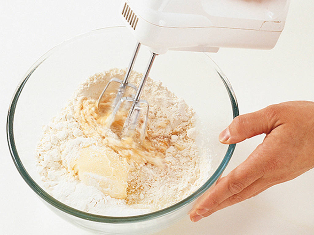 Put all the ingredients into a large bowl and beat together with a hand-held - photo 13