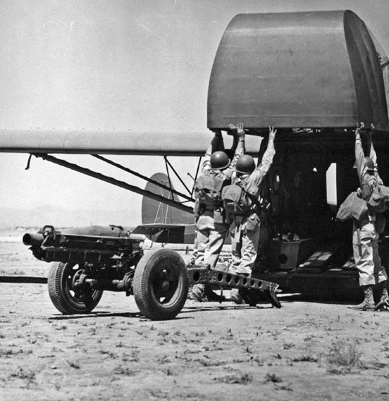 82nd Airborne load a 75 mm howitzer into a CG-4A Troop Glider during training - photo 4