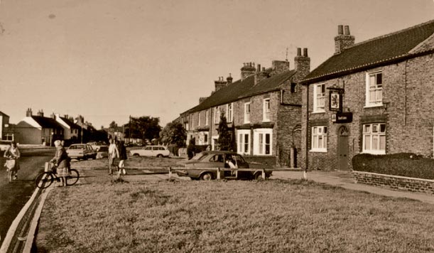 Looking down The Village in the 1970s with the Red Lion on the right Up until - photo 3