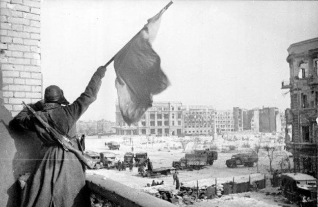 A Soviet soldier waving a flag in Stalingrad in 1943 About Charles River - photo 1