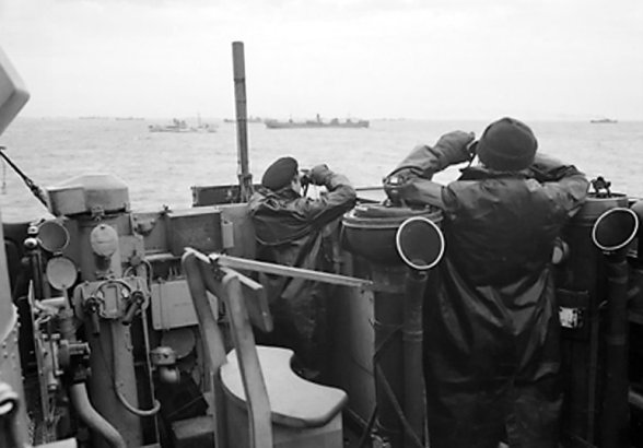 A picture of British officers on a destroyer thats part of a convoy searching - photo 1