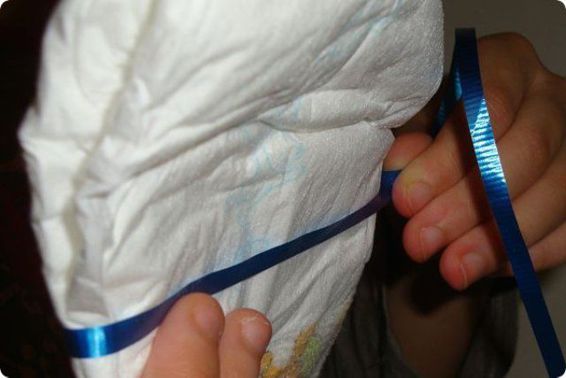 Wrap the curling ribbon completely around the baby diaper This ribbon will be - photo 11