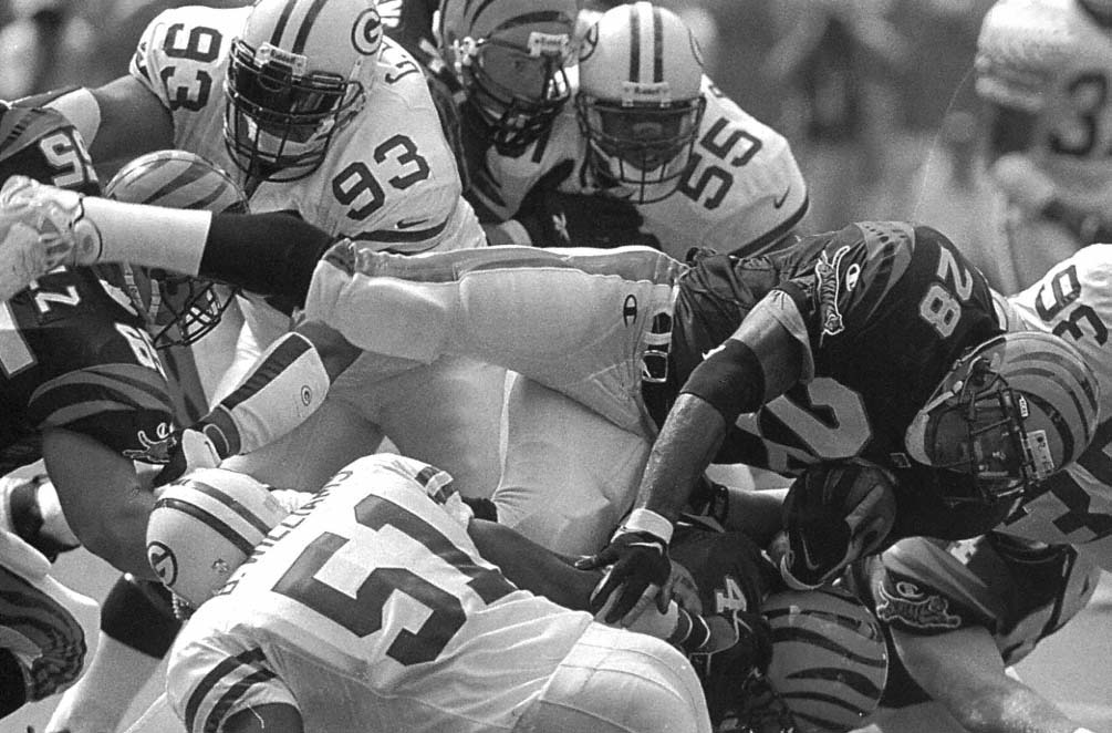 Cincinnati running back Corey Dillon 28 is stopped for no gain by Packer - photo 8