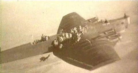 Soviet Paratroops drop off the wing of a TB-3 transport in the 1930s Most - photo 1