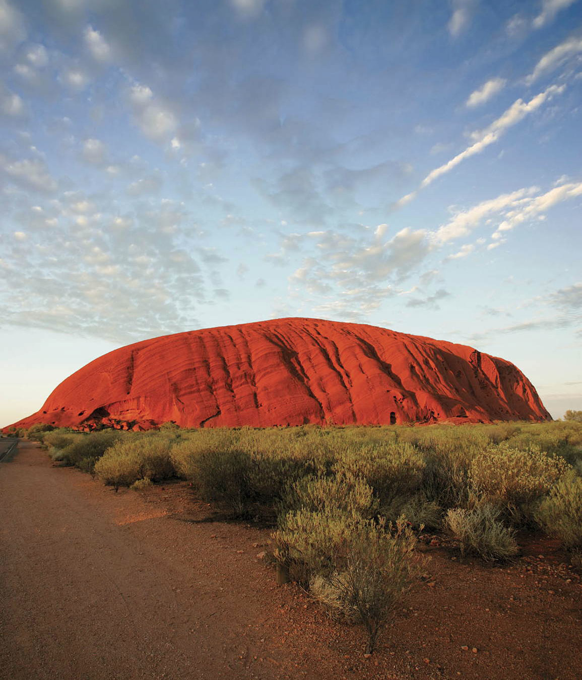 Uluru also known as Ayers Rock towers above the flat lands of the Red Centre - photo 5