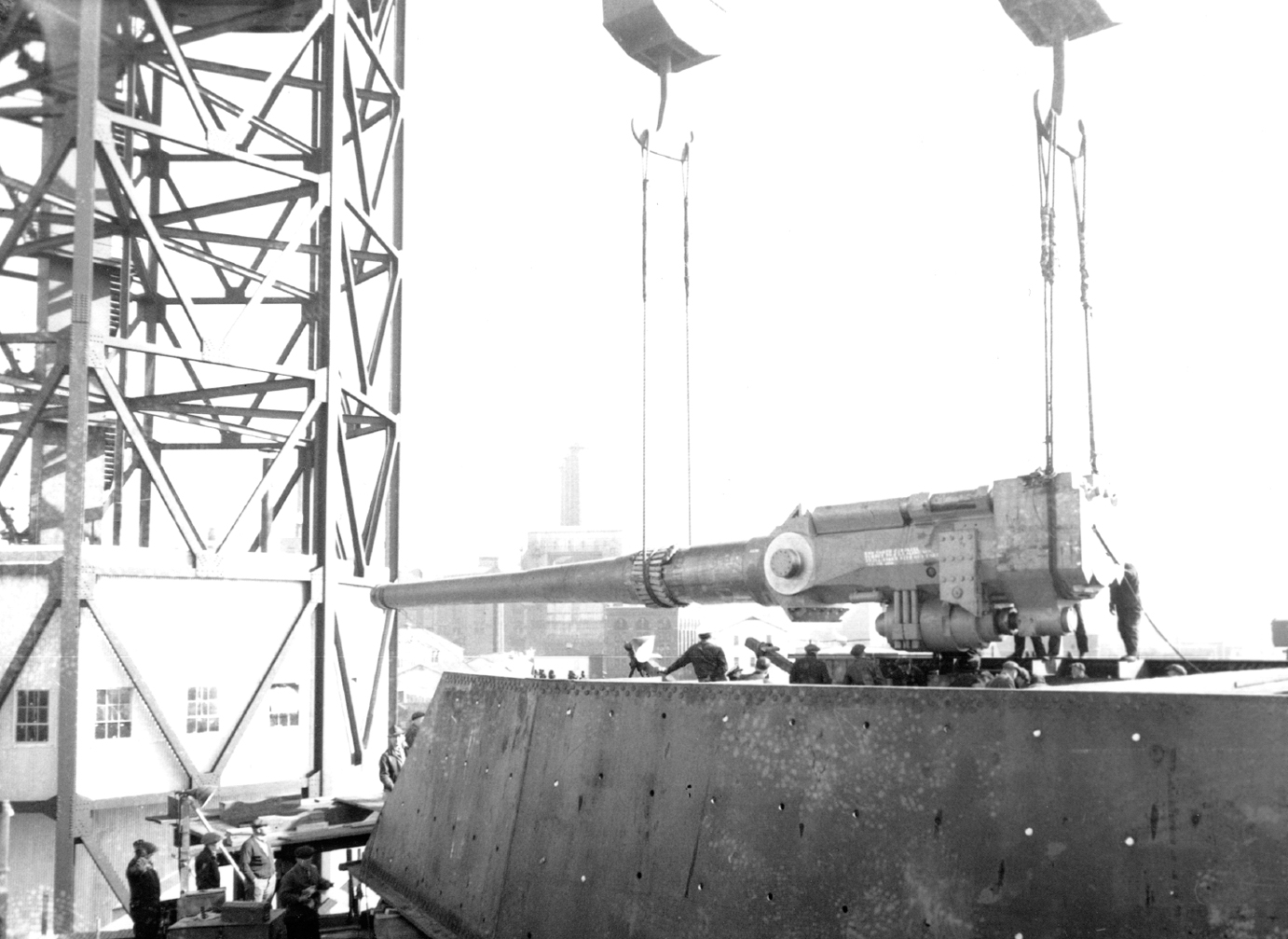 Lowering one of the great sixteen-inch main guns into a turret of the USS North - photo 10