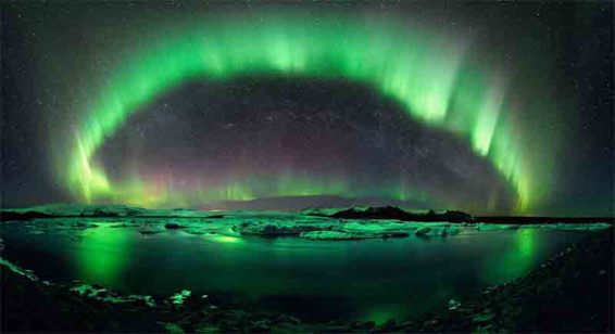 The arc of the aurora is composed of a stunning display of energy contrasted by - photo 4