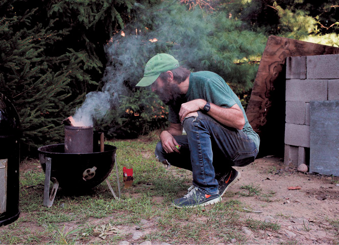 When the charcoal in the chimney is white dump it into the base of the smoker - photo 3