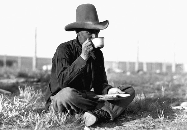 A cowboy finds a quiet place for a meal durning a cattle round up circa 1920 - photo 7