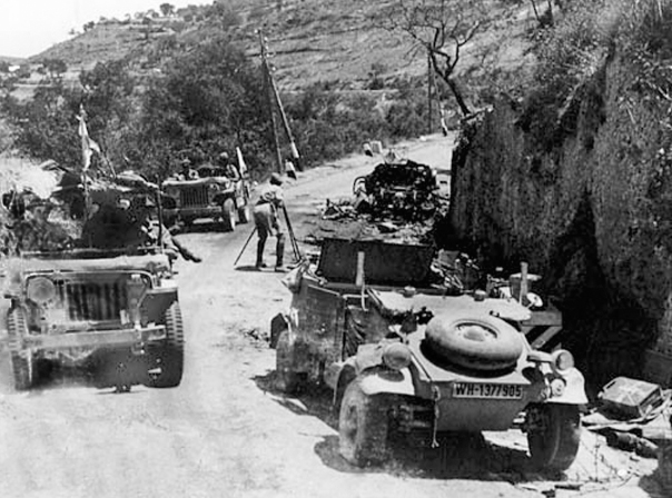 23 Allied jeeps on the way to Agira pass wrecked German Kbelwagen 24 - photo 18