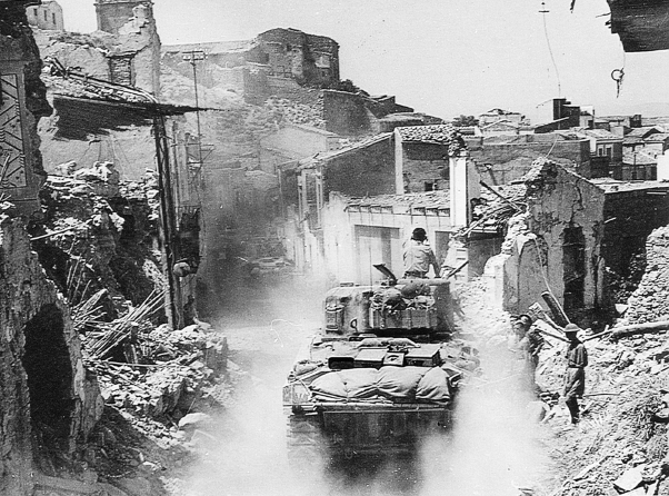 29 Canadian tanks moving through Regalbuto The narrow streets and debris from - photo 24