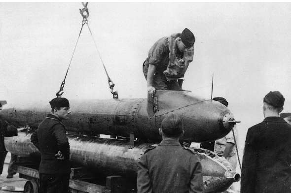 A pilot climbs into the carrier-torpedo the Neger The one-man torpedo - photo 16