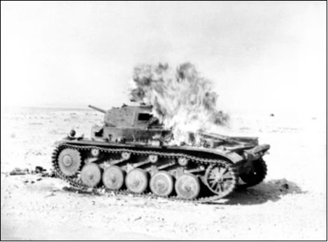 A Panzer II in flames following a hit near Tobruk 1941 In October 1935 General - photo 5