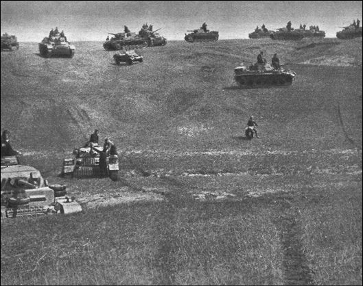 Tanks of the Panzerwaffe silhouetted against the skyline during the advance to - photo 6