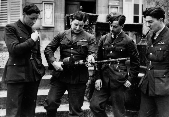 SL Bull Halahan examines a German machine-gun taken as a trophy FO Paul - photo 9