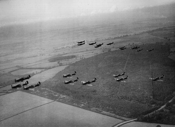 No1 Squadron in the air with a squadron of Spitfires in the background via - photo 21