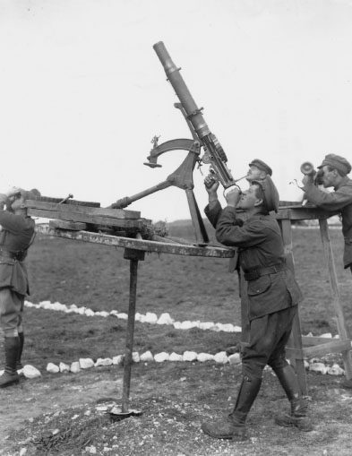 16 A Lewis gun in the anti-aircraft role It is being fired from a mount - photo 18