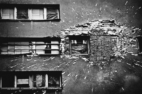 Shrapnel scars virtually every building street and sidewalk in Sarajevo A - photo 3