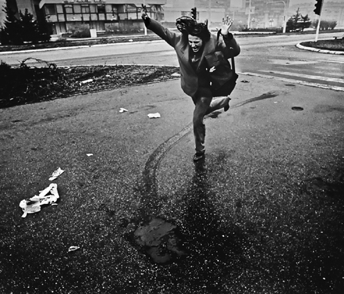 A woman sprints toward safetytrying to avoid the bloody path left by a sniper - photo 4