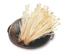 Enokitaki golden mushrooms are clusters of slender cream-colored stalks with - photo 12