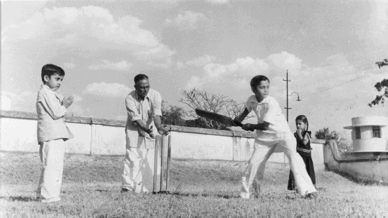 The novelist R K Narayan playing cricket with his nephews Mysore 1950 - photo 5