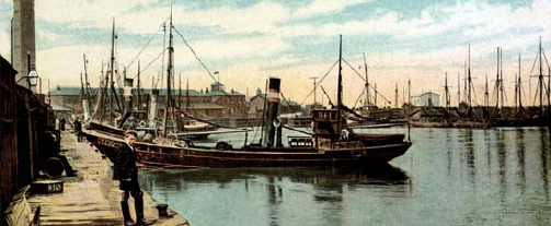 A young man poses in front of an early steam trawler in Grimsby docks This - photo 8